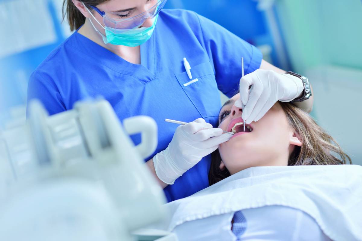 Woman lying in the dentist's chair having a checkup